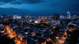 Aerial twilight view of a Tokyo neighborhood showing traditional buildings adjacent to modern redevelopment